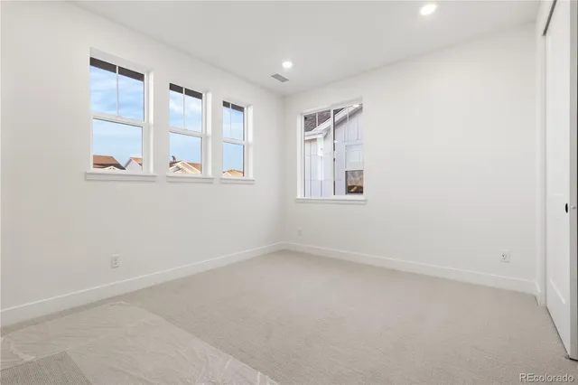 an empty room with windows