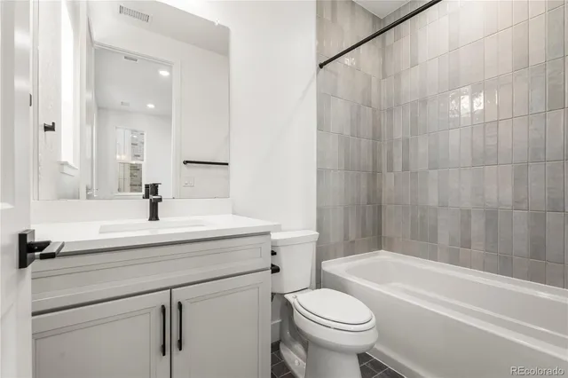 a bathroom with a sink a toilet and a bathtub