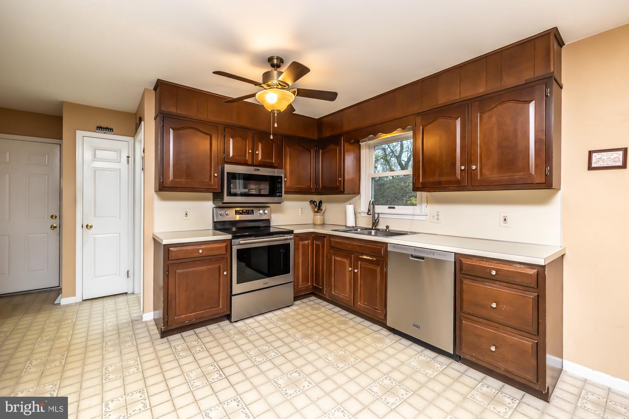 30 Estates Drive Reading, PA 19606 - Photo 17 of 45 a kitchen with granite countertop stainless steel appliances and wooden cabinets