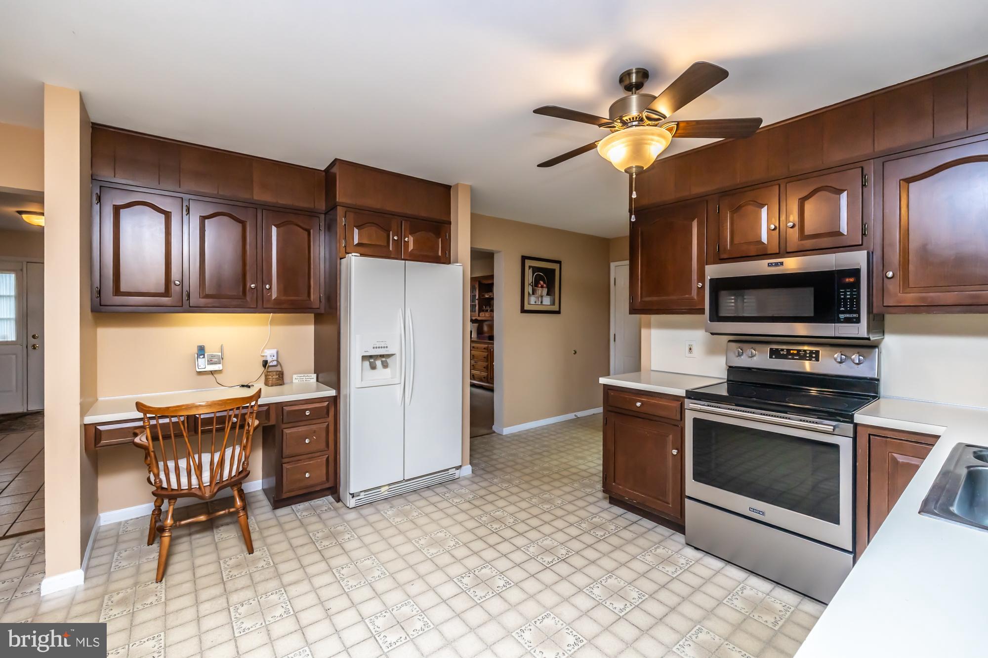 30 Estates Drive Reading, PA 19606 - Photo 18 of 45 a kitchen with stainless steel appliances granite countertop a refrigerator stove microwave and sink