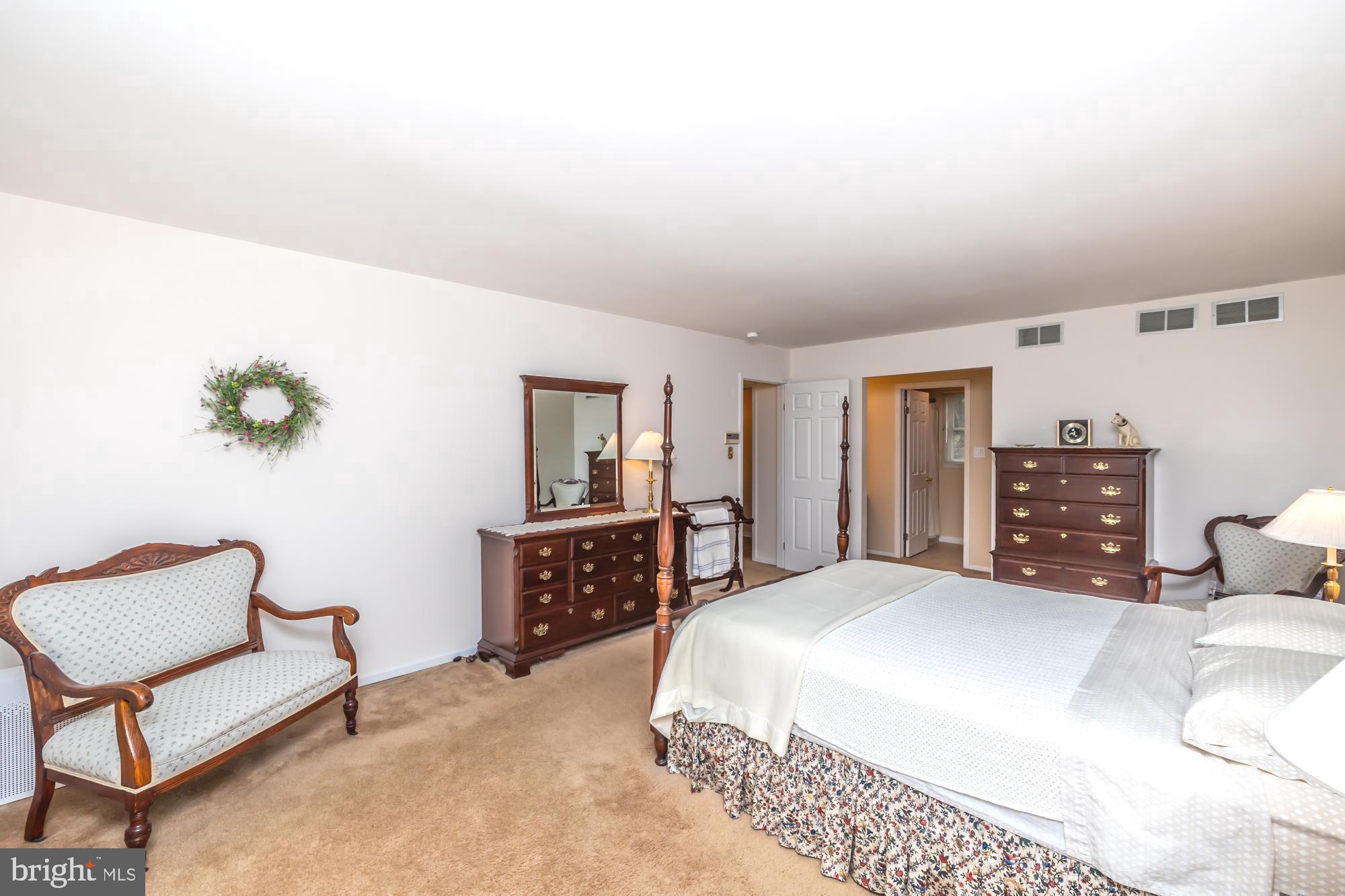 30 Estates Drive Reading, PA 19606 - Photo 27 of 45 a bedroom with a bed and dresser with mirror