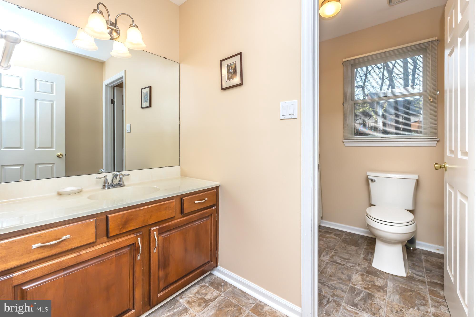 30 Estates Drive Reading, PA 19606 - Photo 36 of 45 a bathroom with a granite countertop sink mirror vanity and toilet