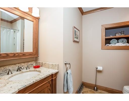 8 Springhouse Road Hampden, MA 01036 - Photo 18 of 30 a bathroom with a granite countertop sink a mirror and vanity