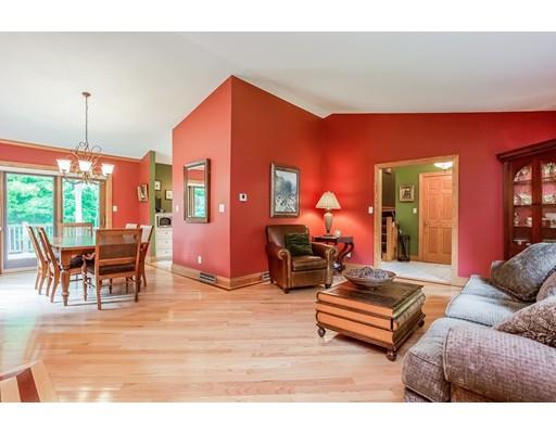 8 Springhouse Road Hampden, MA 01036 - Photo 3 of 30 a living room with furniture a lamp and a dining table