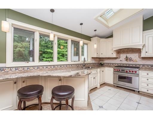 8 Springhouse Road Hampden, MA 01036 - Photo 7 of 30 a kitchen with a stove a sink and a refrigerator