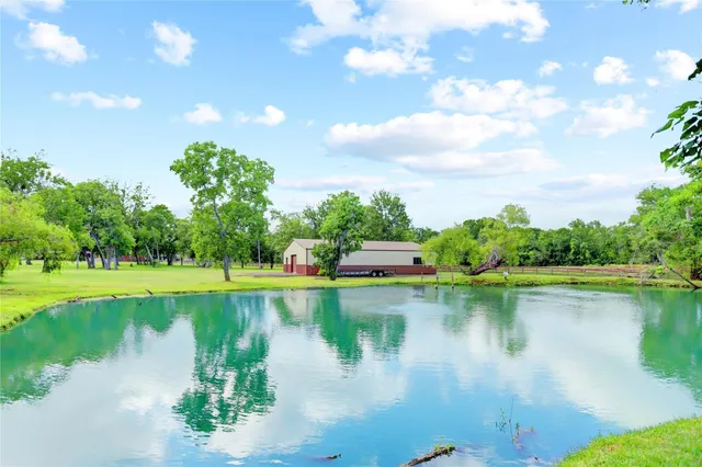 a view of a lake with a house in the background