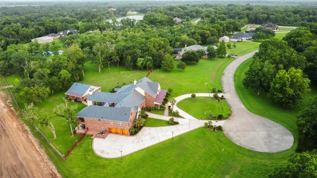 an aerial view of a house with outdoor space pool patio swimming pool and outdoor seating