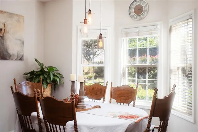 a view of a dining room with furniture window and outside view