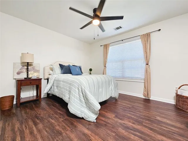 a bedroom with a bed and a table in it