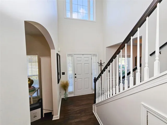a view of an entryway with wooden floor