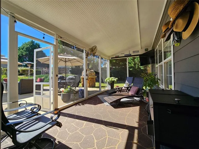 a view of a swimming pool with a patio