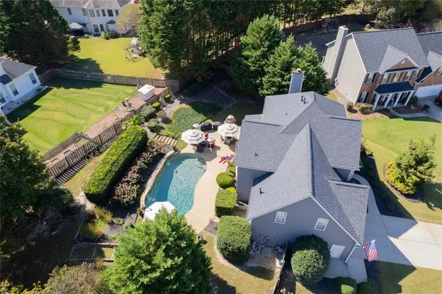 a view of a park with large trees