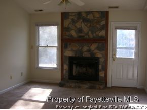 6475 Applewhite Road Fayetteville, NC 28304 - Photo 3 of 6 a view of an empty room with a window