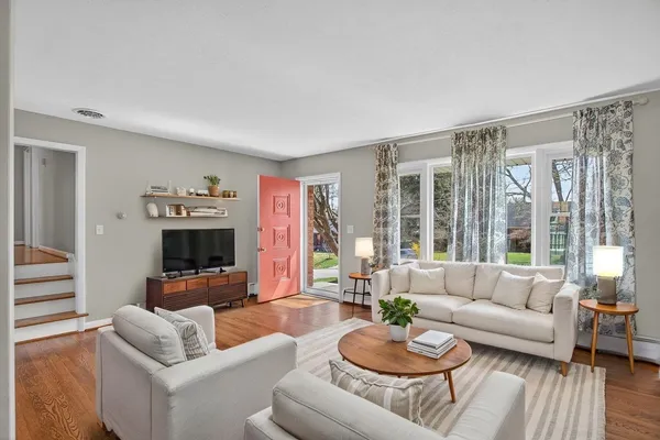 a view of livingroom with furniture wooden floor and windows