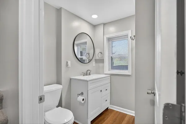a kitchen with a stove window and cabinets