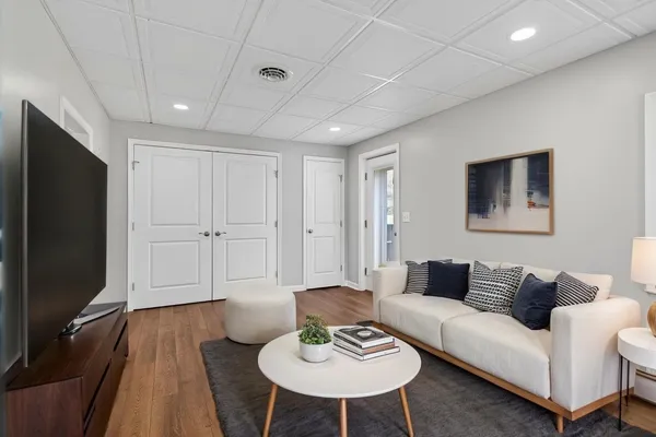 a view of a house with pool and sitting area