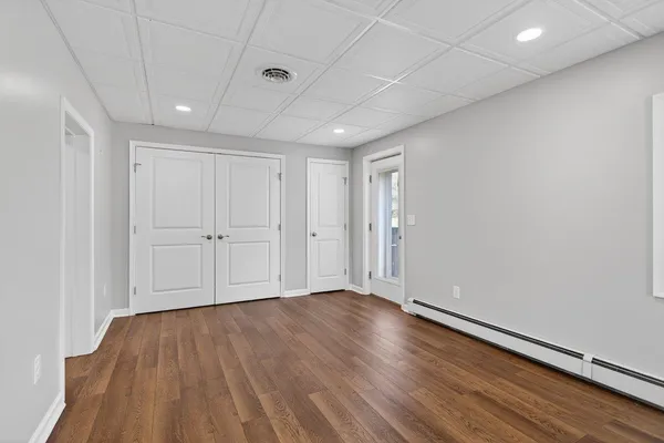 a view of a street with houses in the background