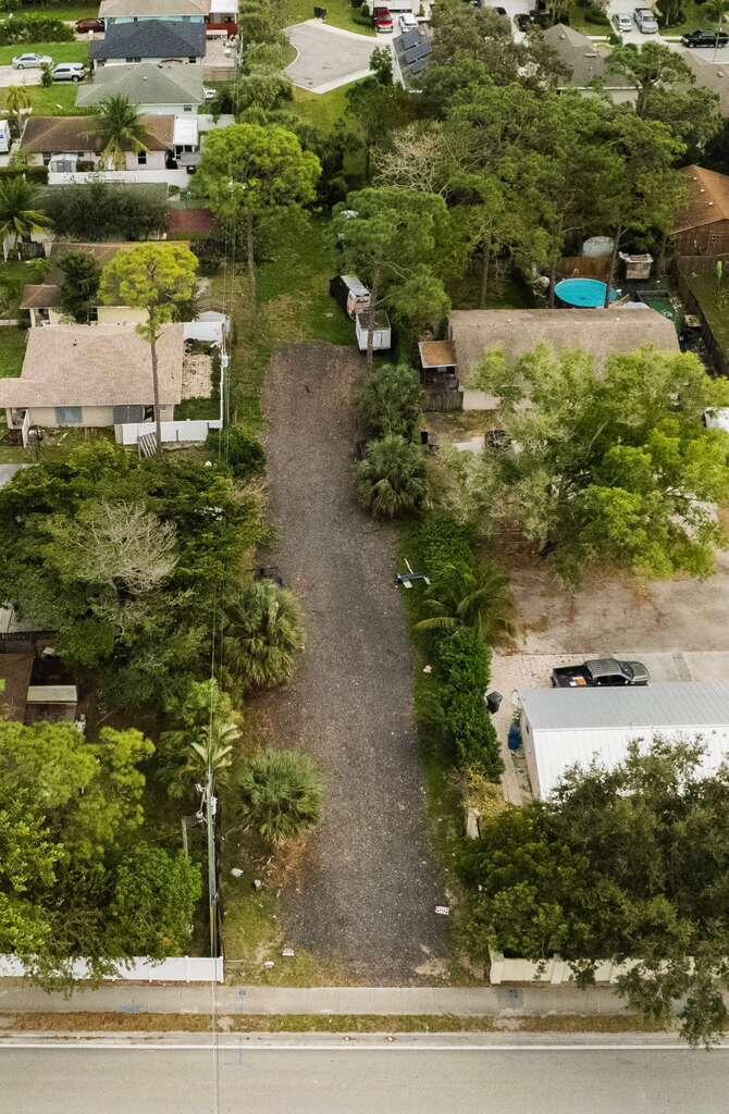 3630 South Haverhill Road Greenacres, FL 33463 - Photo 3 of 9 an aerial view of residential houses with outdoor space and parking