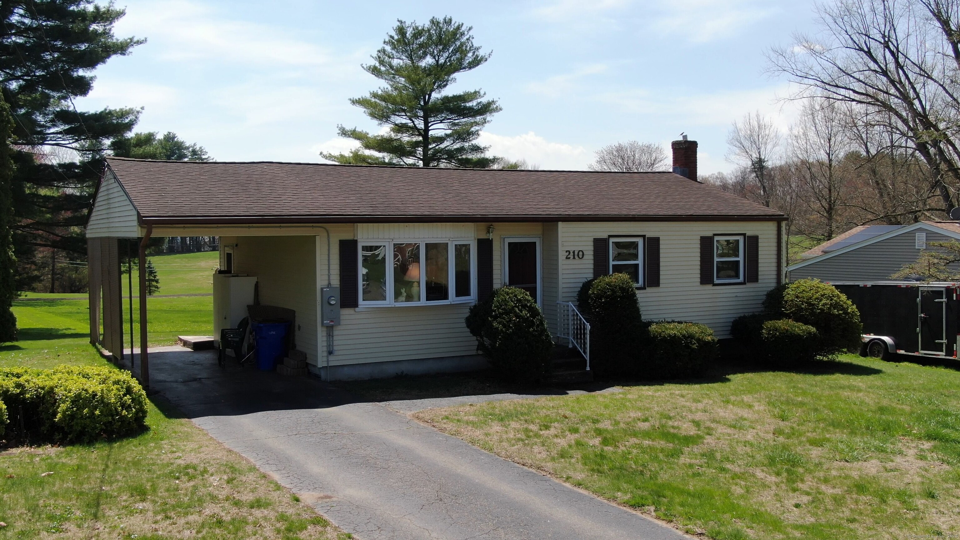210 Reed Avenue Windsor Locks, CT 06096 - Photo 1 of 1 a front view of a house with a yard and potted plants