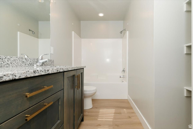 226 South 600 West Logan, UT 84321 - Photo 21 of 25 Full bathroom with vanity, light wood-style flooring, shower / tub combination, and recessed lighting