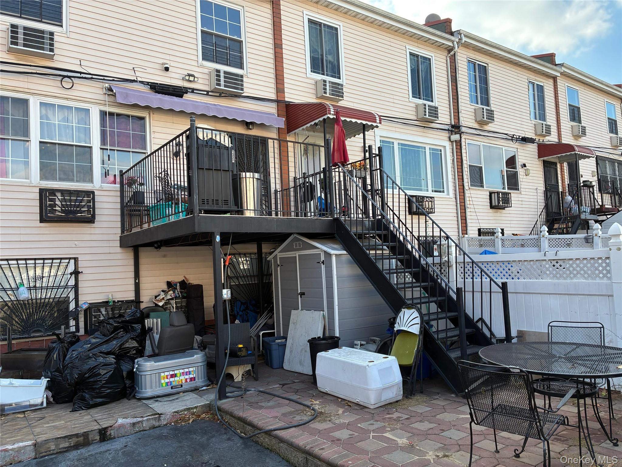 21 Renaissance Court Brooklyn, NY 11206 - Photo 17 of 21 a front view of a building with multiple windows