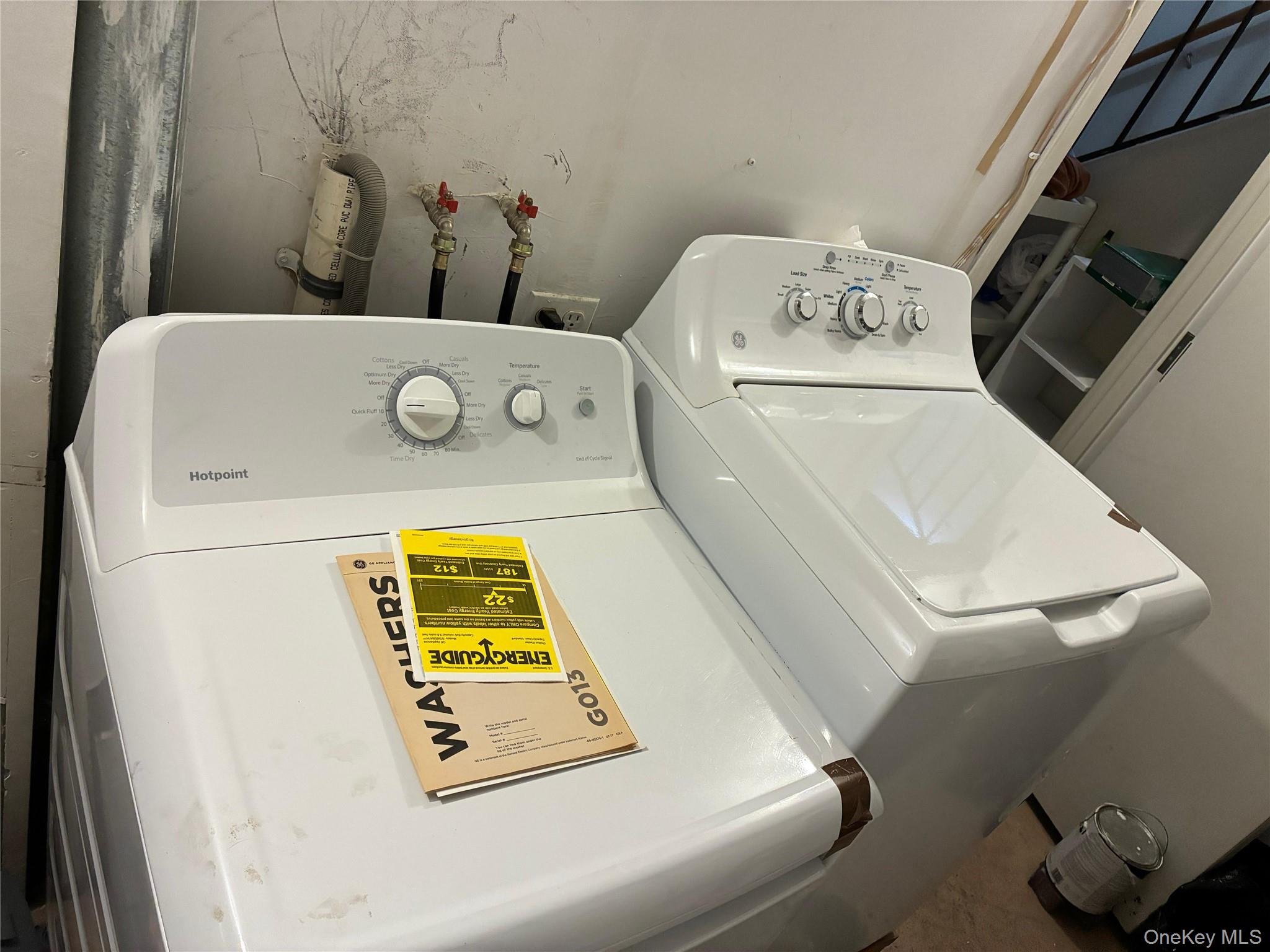 21 Renaissance Court Brooklyn, NY 11206 - Photo 19 of 21 a utility room with dryer and washer