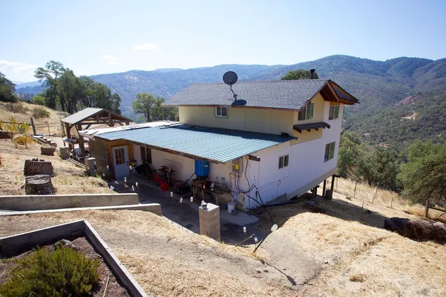 a aerial view of a house with a yard