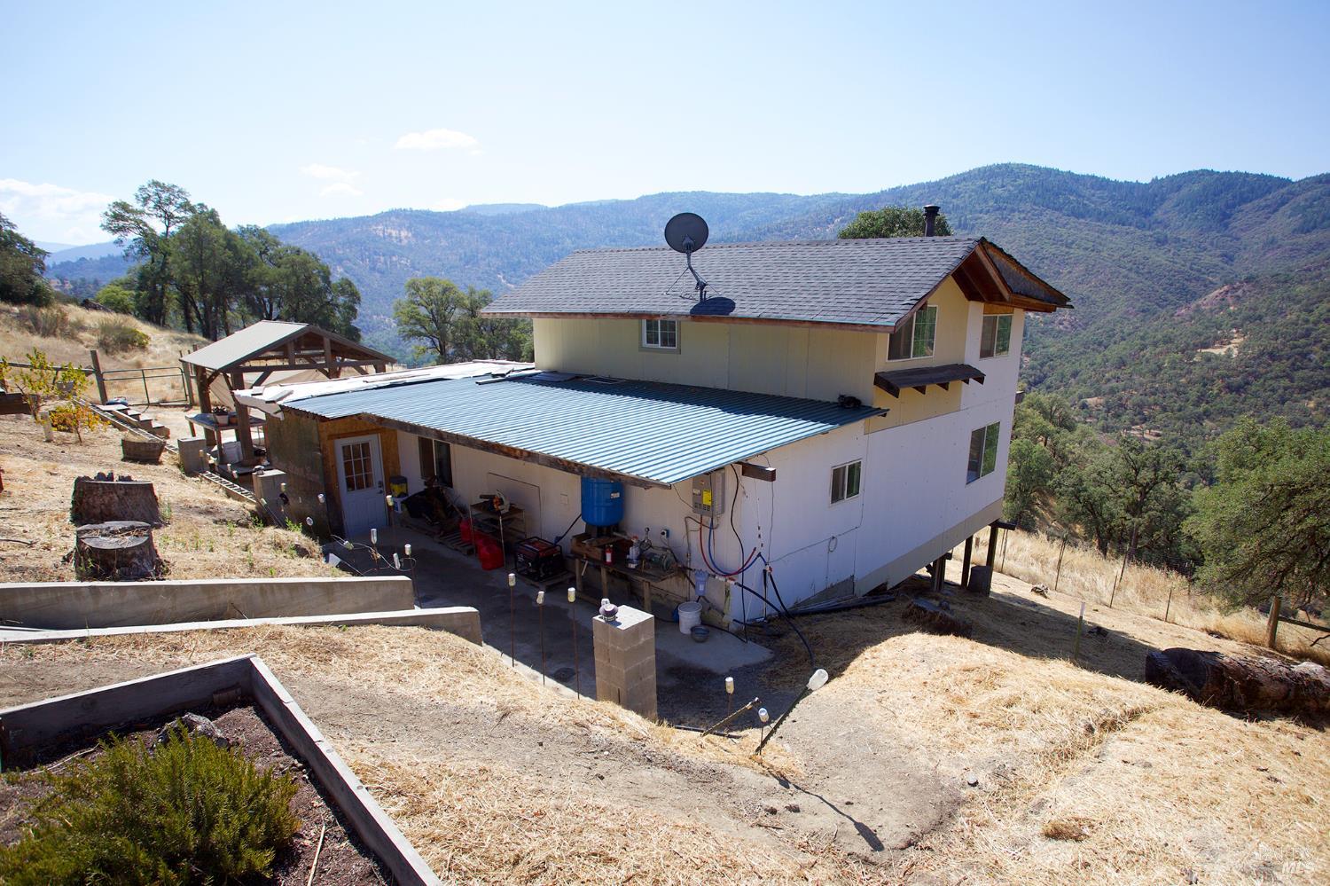 35100 Mendocino Pass Road Covelo, CA 95428 - Photo 2 of 14 a aerial view of a house with a yard
