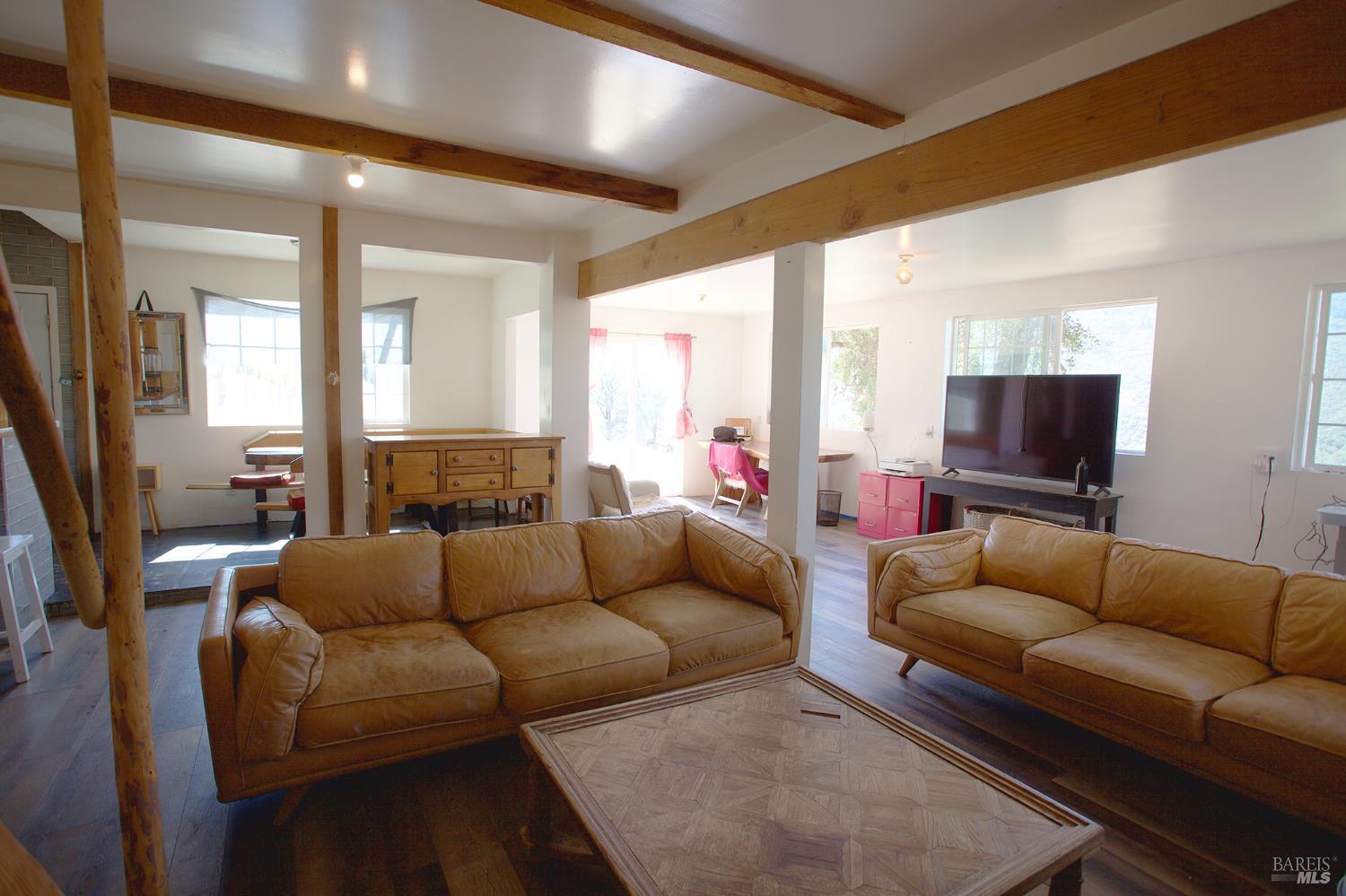 35100 Mendocino Pass Road Covelo, CA 95428 - Photo 5 of 14 a living room with furniture and a flat screen tv