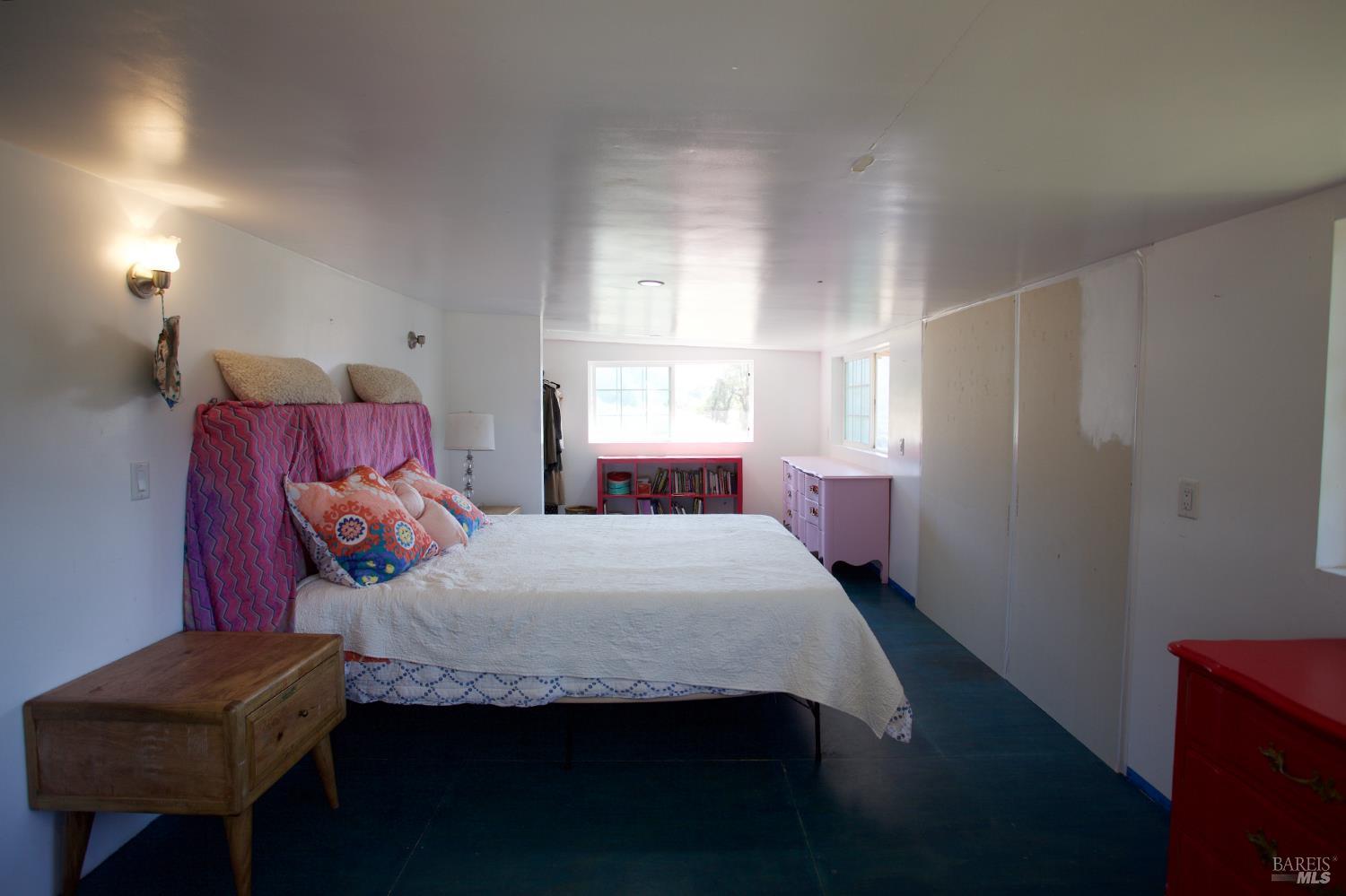 35100 Mendocino Pass Road Covelo, CA 95428 - Photo 6 of 14 a bedroom with a bed and window