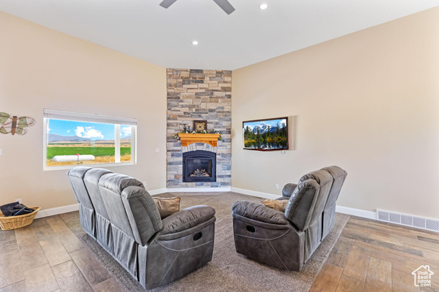 19502 South Olson Road Downey, ID 83234 - Photo 6 of 64 Living room featuring a stone fireplace, wood finished floors, and recessed lighting