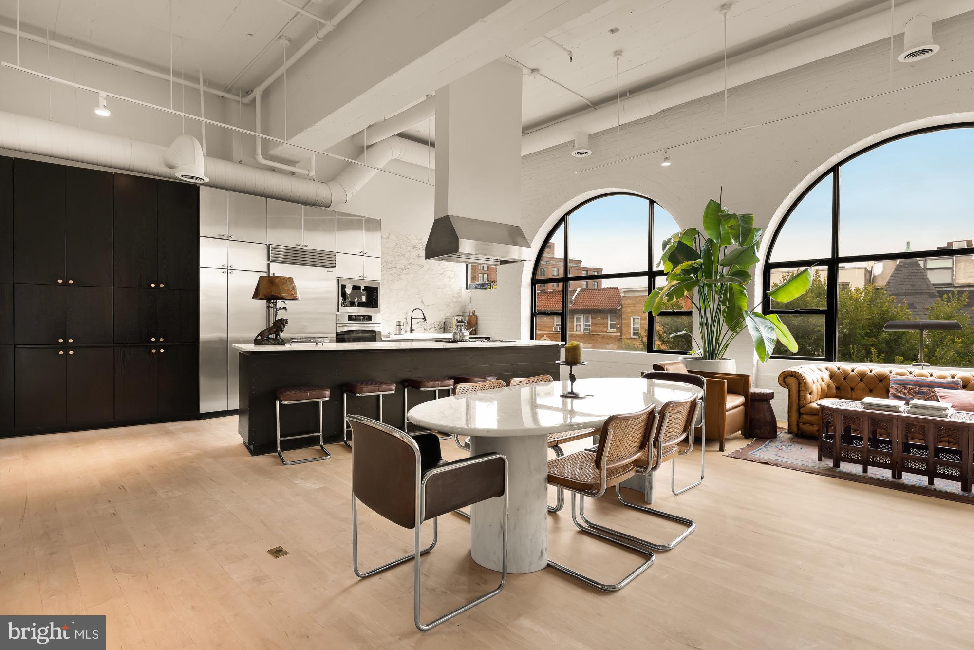2424 18th Street Northwest, Unit R1 Washington, DC 20009 - Photo 11 of 24 a dining room with furniture and a large window