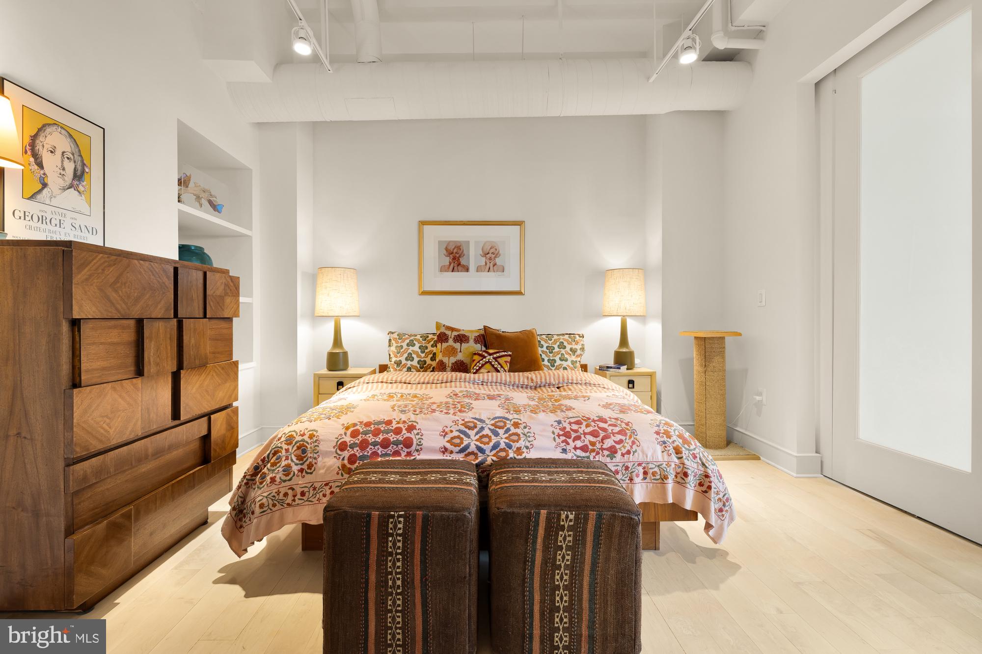 2424 18th Street Northwest, Unit R1 Washington, DC 20009 - Photo 17 of 24 a bedroom with a bed and a cabinets