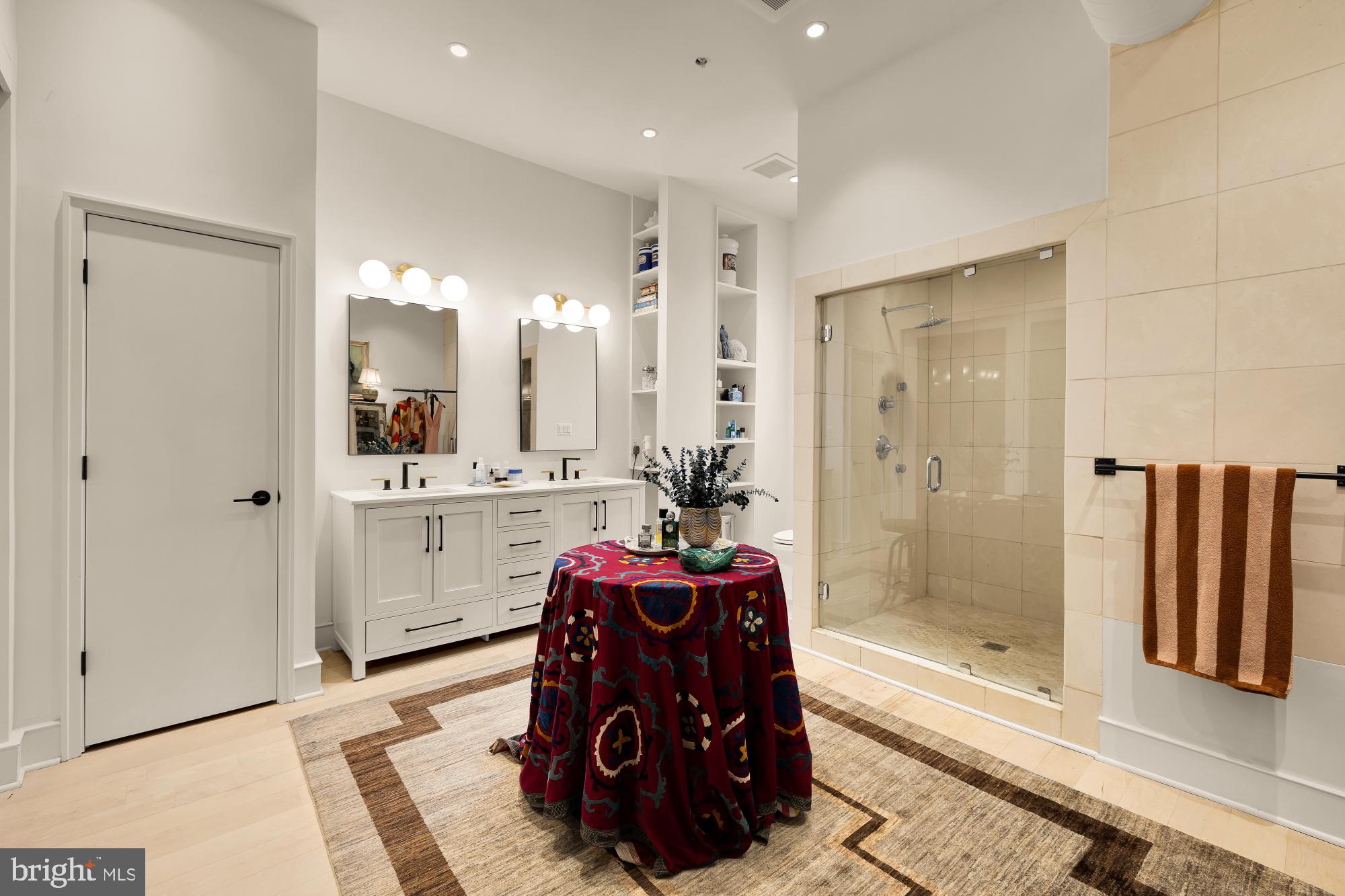 2424 18th Street Northwest, Unit R1 Washington, DC 20009 - Photo 19 of 24 a bathroom with a granite countertop sink a mirror and a shower