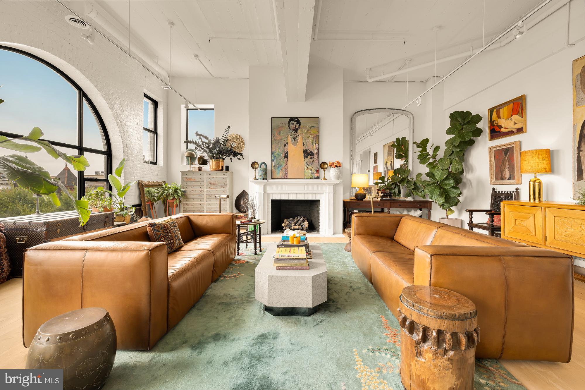 2424 18th Street Northwest, Unit R1 Washington, DC 20009 - Photo 2 of 24 a living room with furniture a fireplace and a large mirror