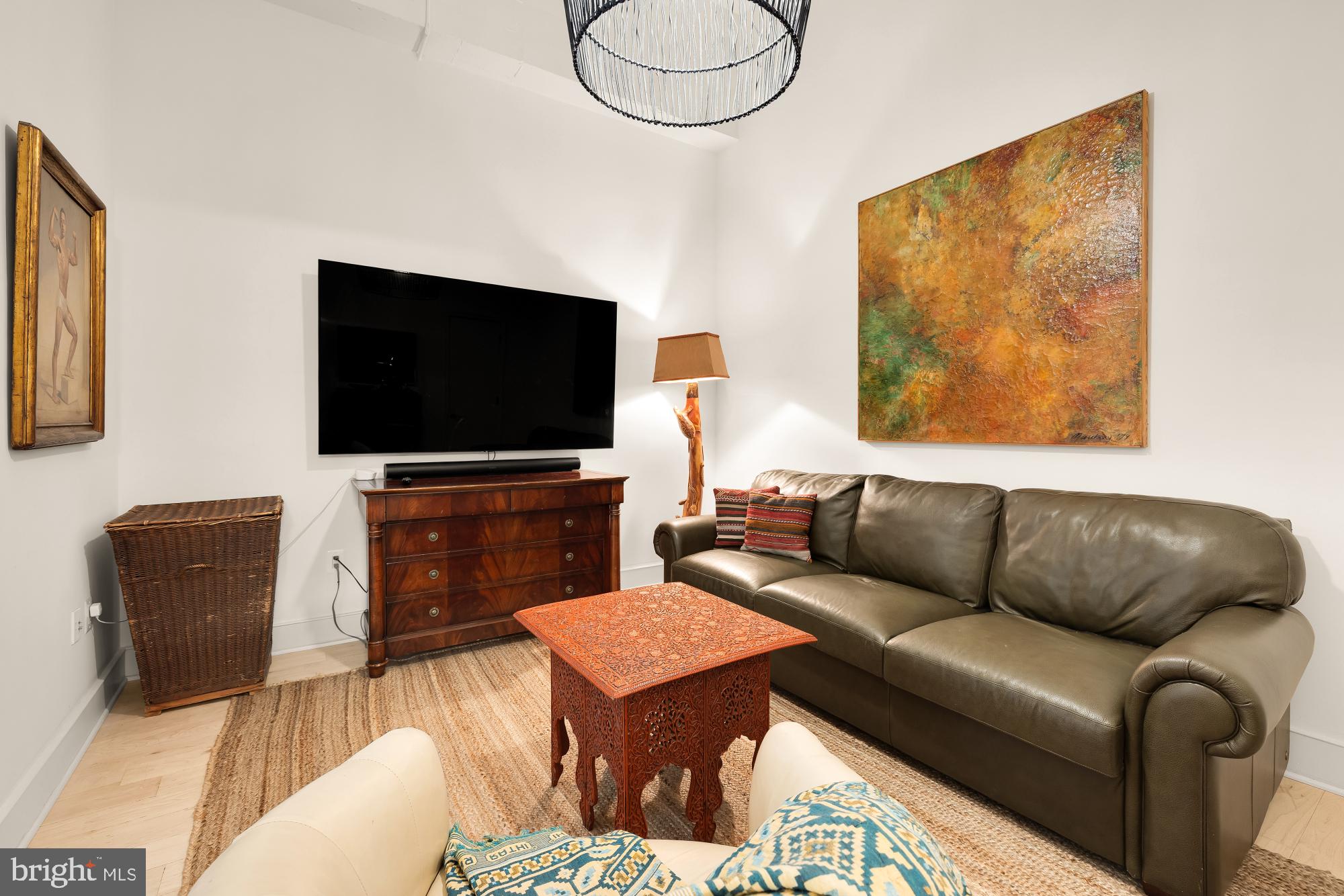 2424 18th Street Northwest, Unit R1 Washington, DC 20009 - Photo 21 of 24 a living room with furniture and a flat screen tv