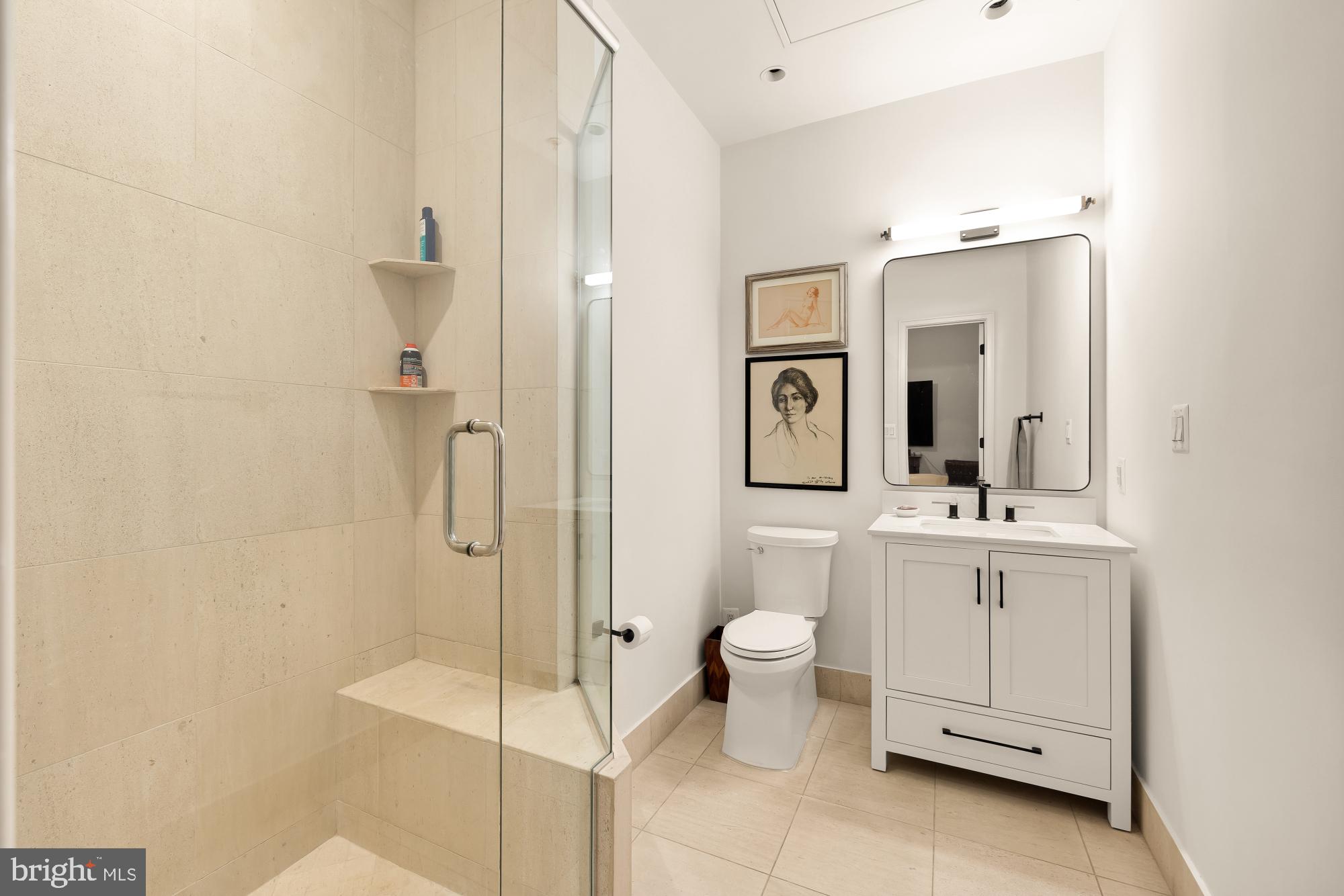 2424 18th Street Northwest, Unit R1 Washington, DC 20009 - Photo 22 of 24 a bathroom with a toilet sink and shower