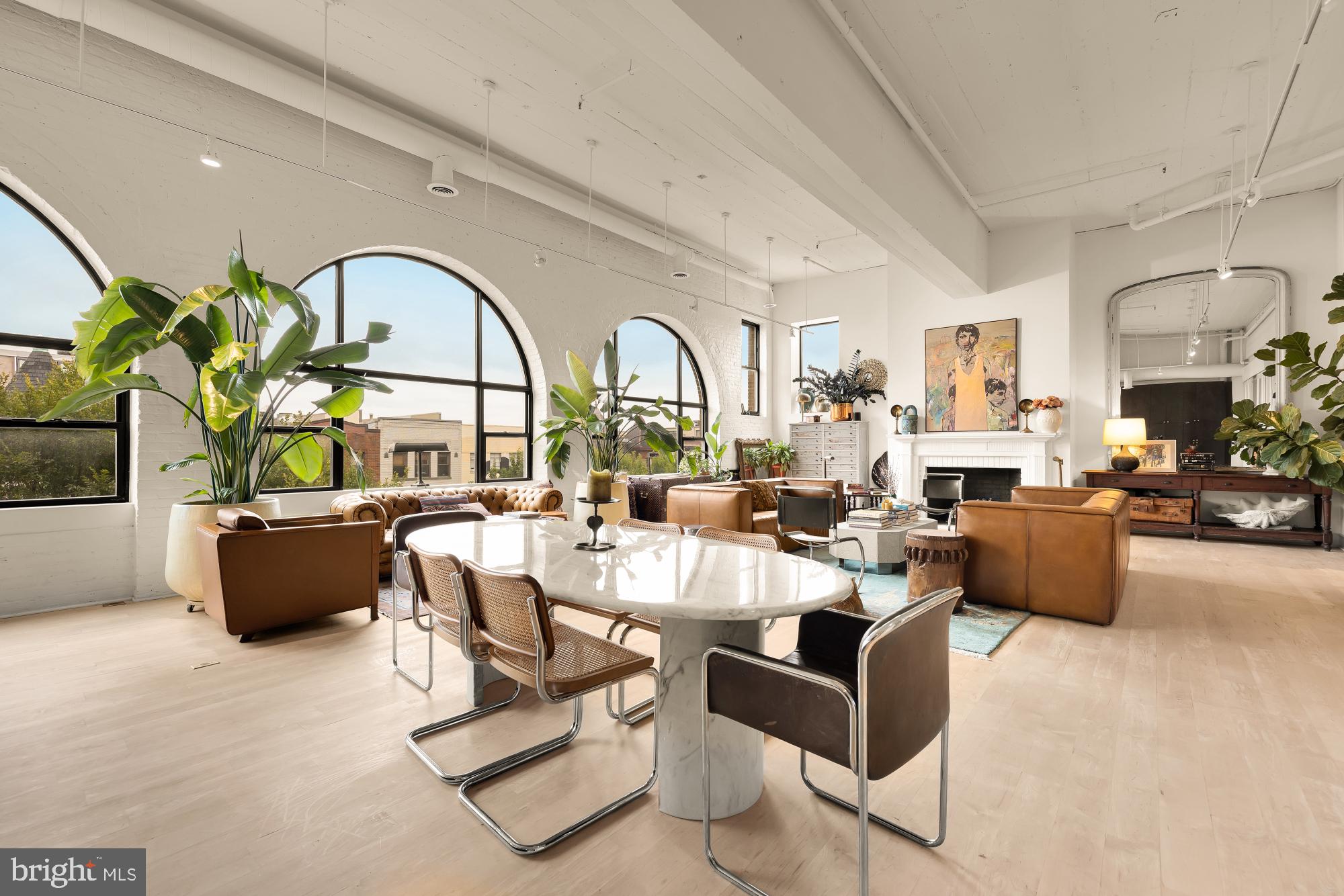 2424 18th Street Northwest, Unit R1 Washington, DC 20009 - Photo 9 of 24 a living room with fireplace furniture and a large window