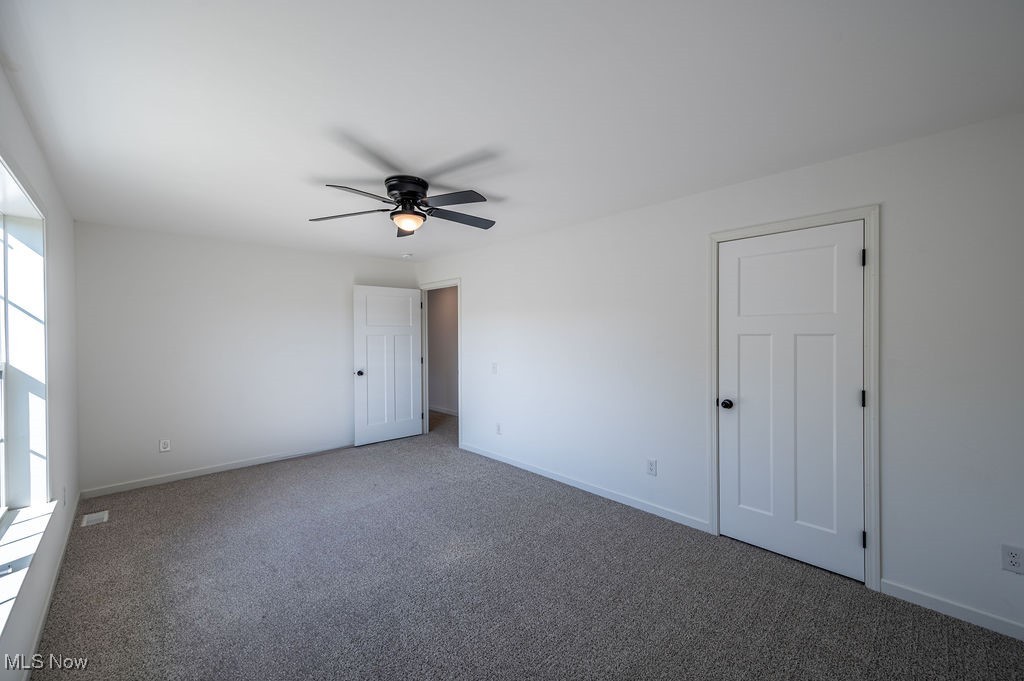 7343 Lost Pavement Road Belleville, WV 26133 - Photo 27 of 49 Unfurnished bedroom with carpet and ceiling fan