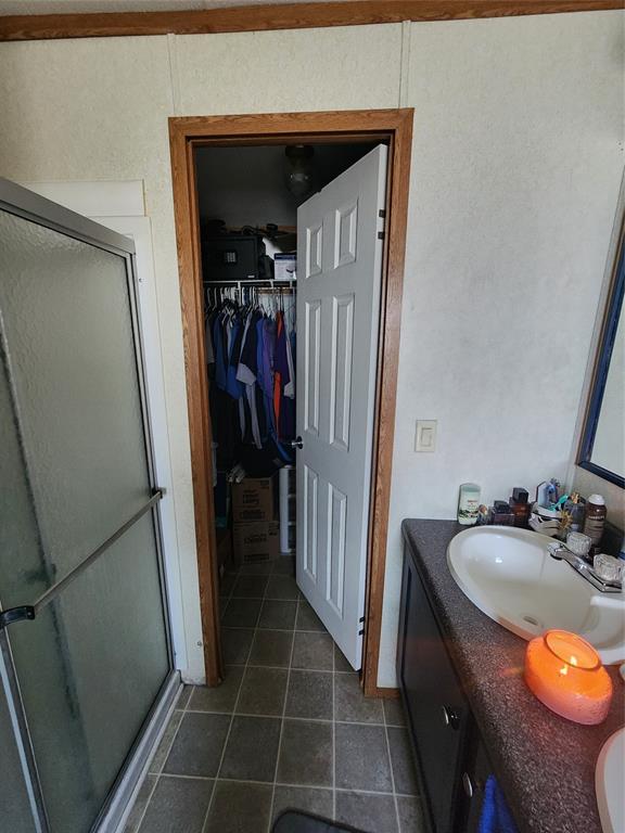 7120 Golden Meadows Road Greenwood, LA 71033 - Photo 12 of 14 a bathroom with a sink a toilet and a shower