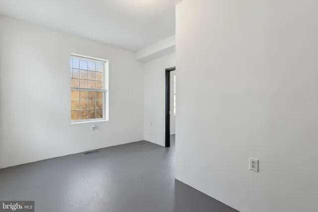 an empty room with windows