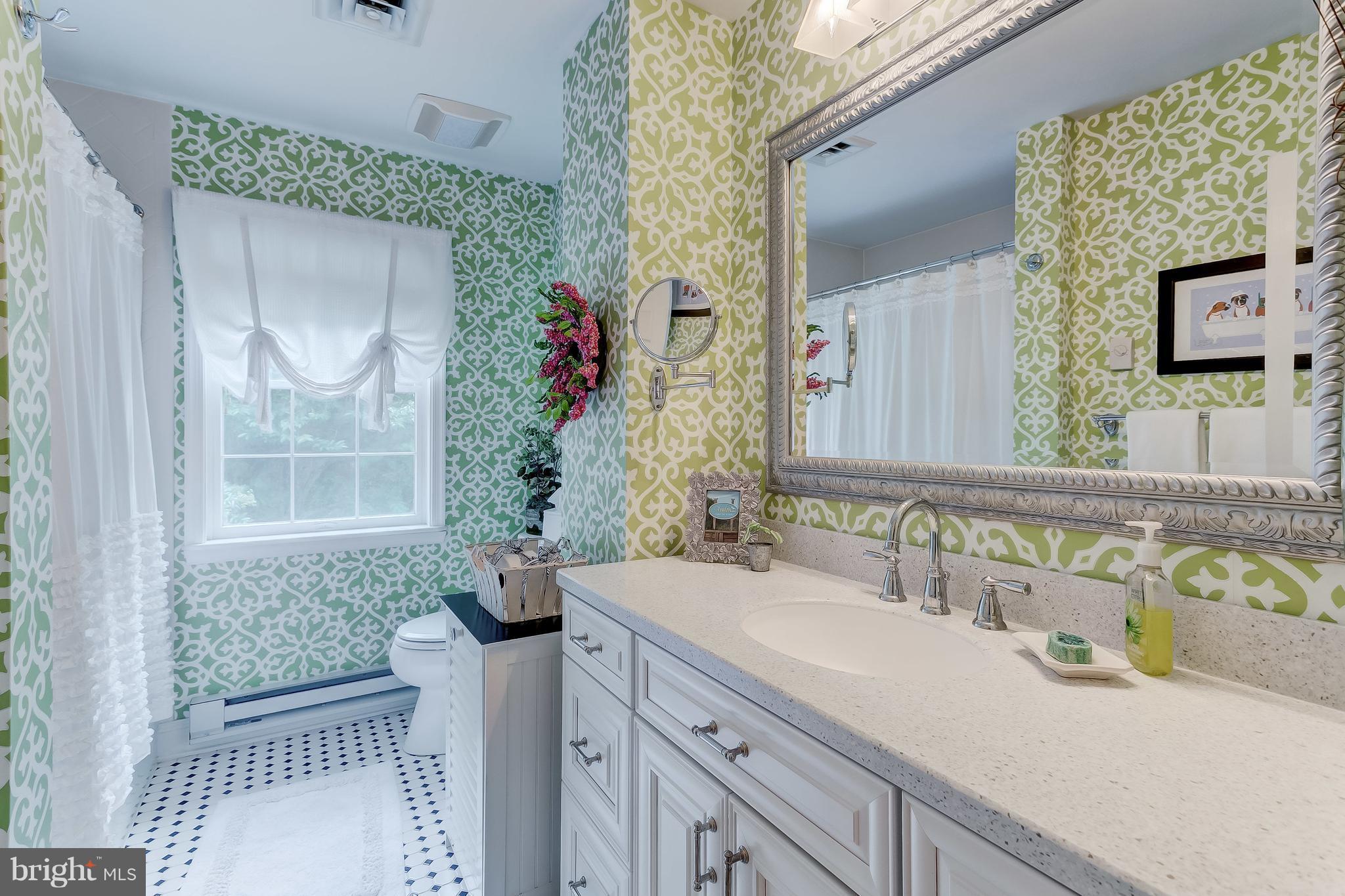 14606 Quaker Bottom Road Sparks, MD 21152 - Photo 20 of 30 a bathroom with a granite countertop sink and a mirror