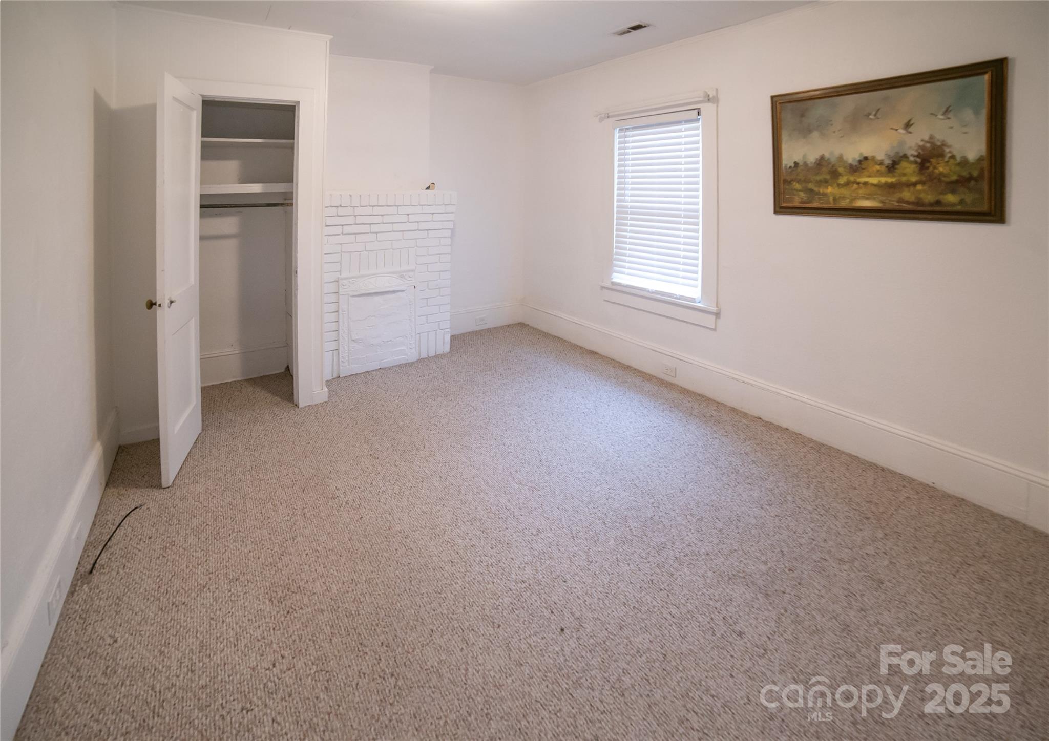 175 Blue Ridge Street Marion, NC 28752 - Photo 15 of 15 an empty room with closet and windows