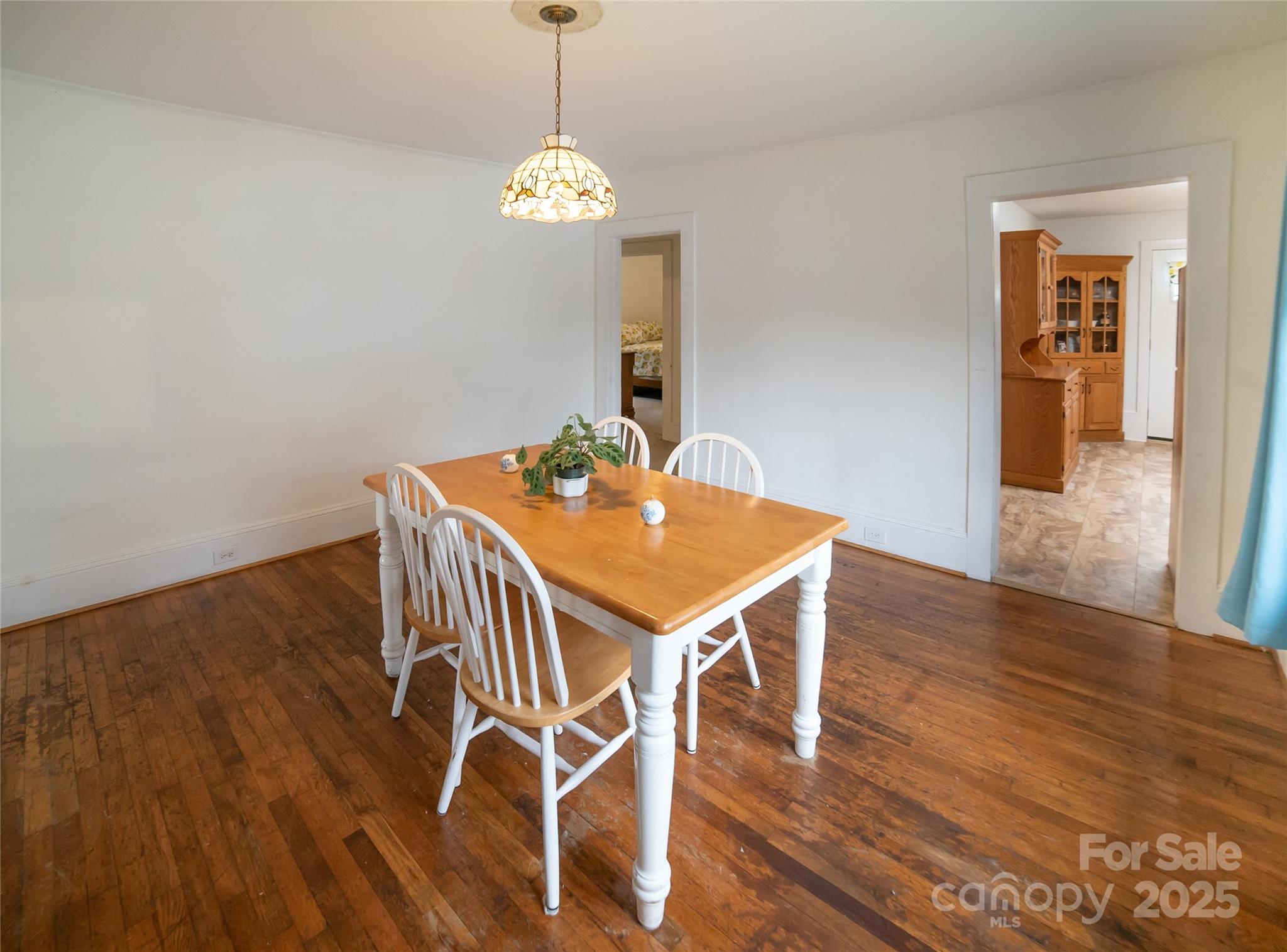 175 Blue Ridge Street Marion, NC 28752 - Photo 8 of 15 a view of a dining room with furniture and wooden floor