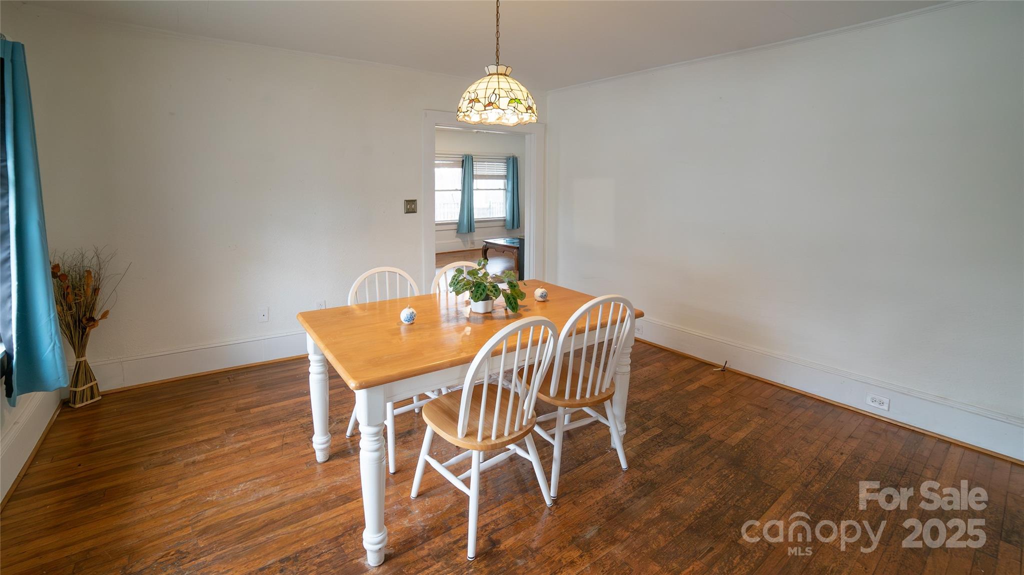 175 Blue Ridge Street Marion, NC 28752 - Photo 9 of 15 a view of a dining room with furniture and wooden floor