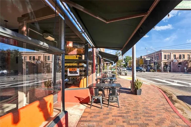 a view of a swimming pool with outdoor seating