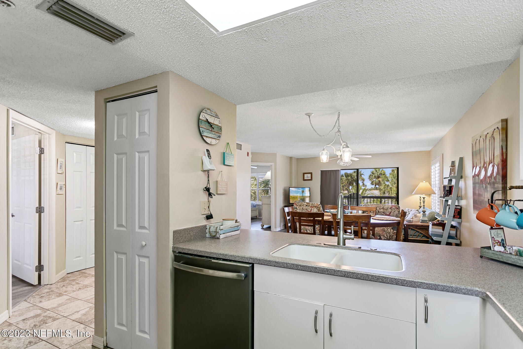 4250 Florida A1A, Unit I26 St. Augustine, FL 32080 - Photo 11 of 49 a kitchen with stainless steel appliances granite countertop a sink and a refrigerator