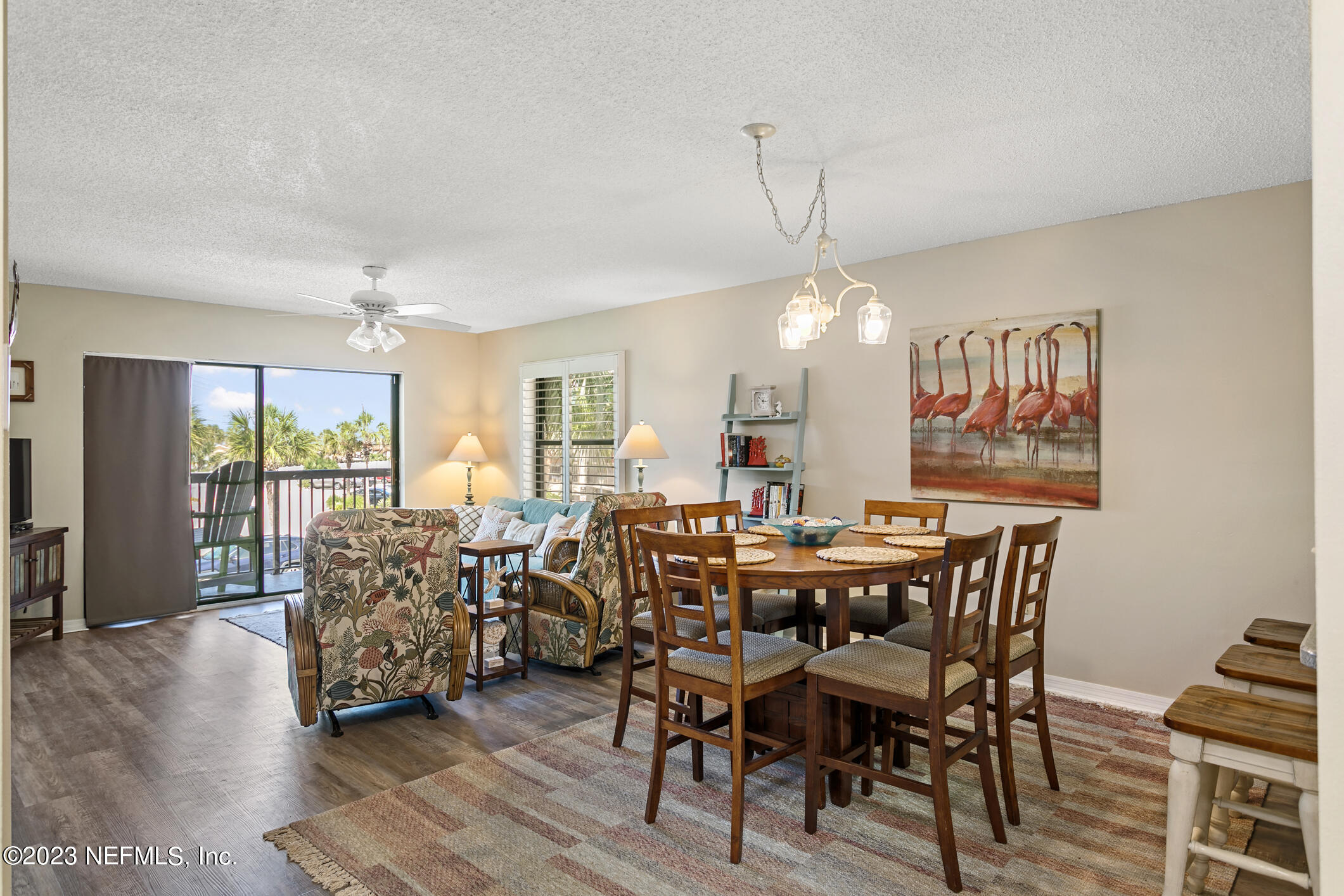 4250 Florida A1A, Unit I26 St. Augustine, FL 32080 - Photo 13 of 49 a view of a dining room with furniture window and wooden floor