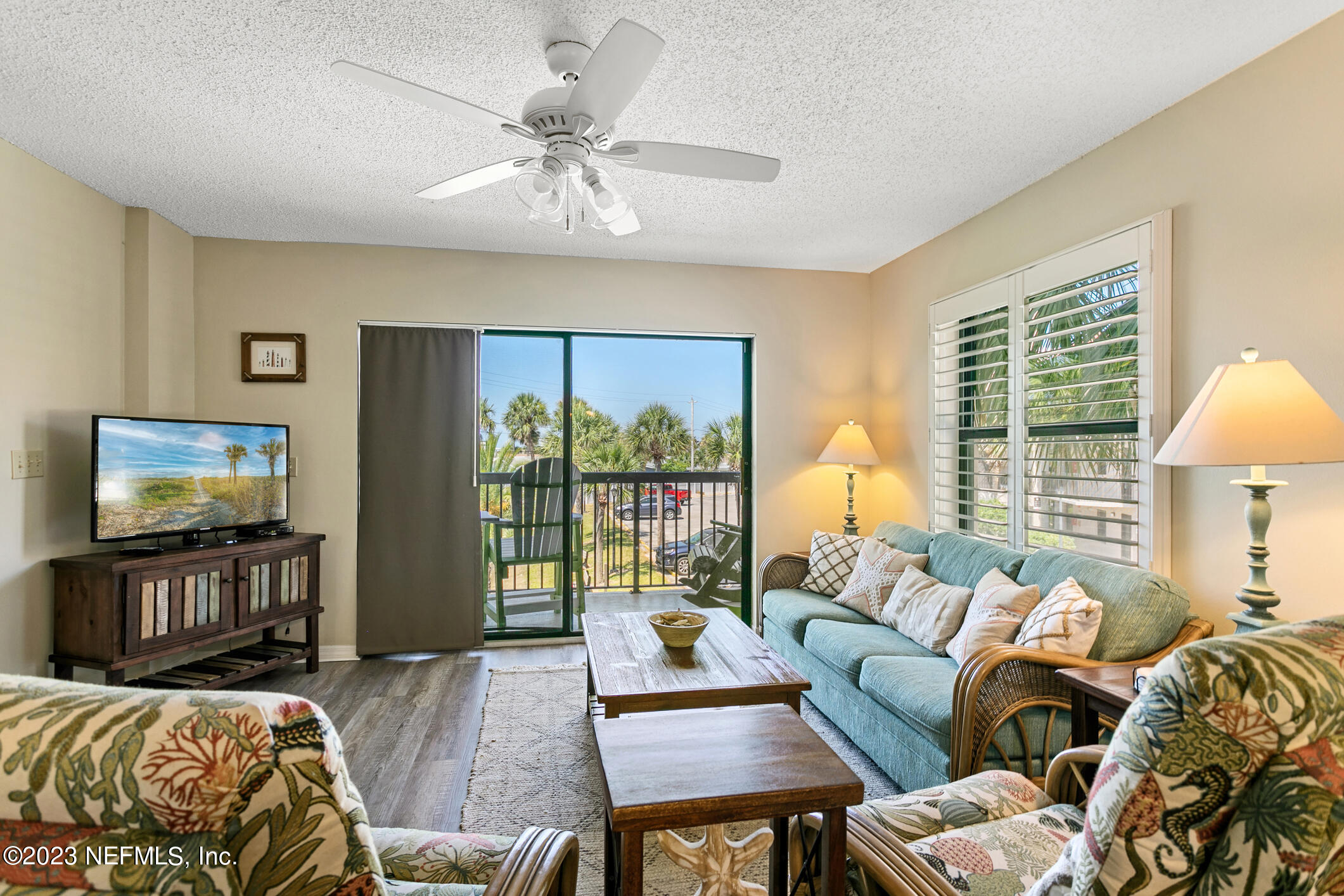 4250 Florida A1A, Unit I26 St. Augustine, FL 32080 - Photo 16 of 49 a bedroom with furniture and a flat screen tv
