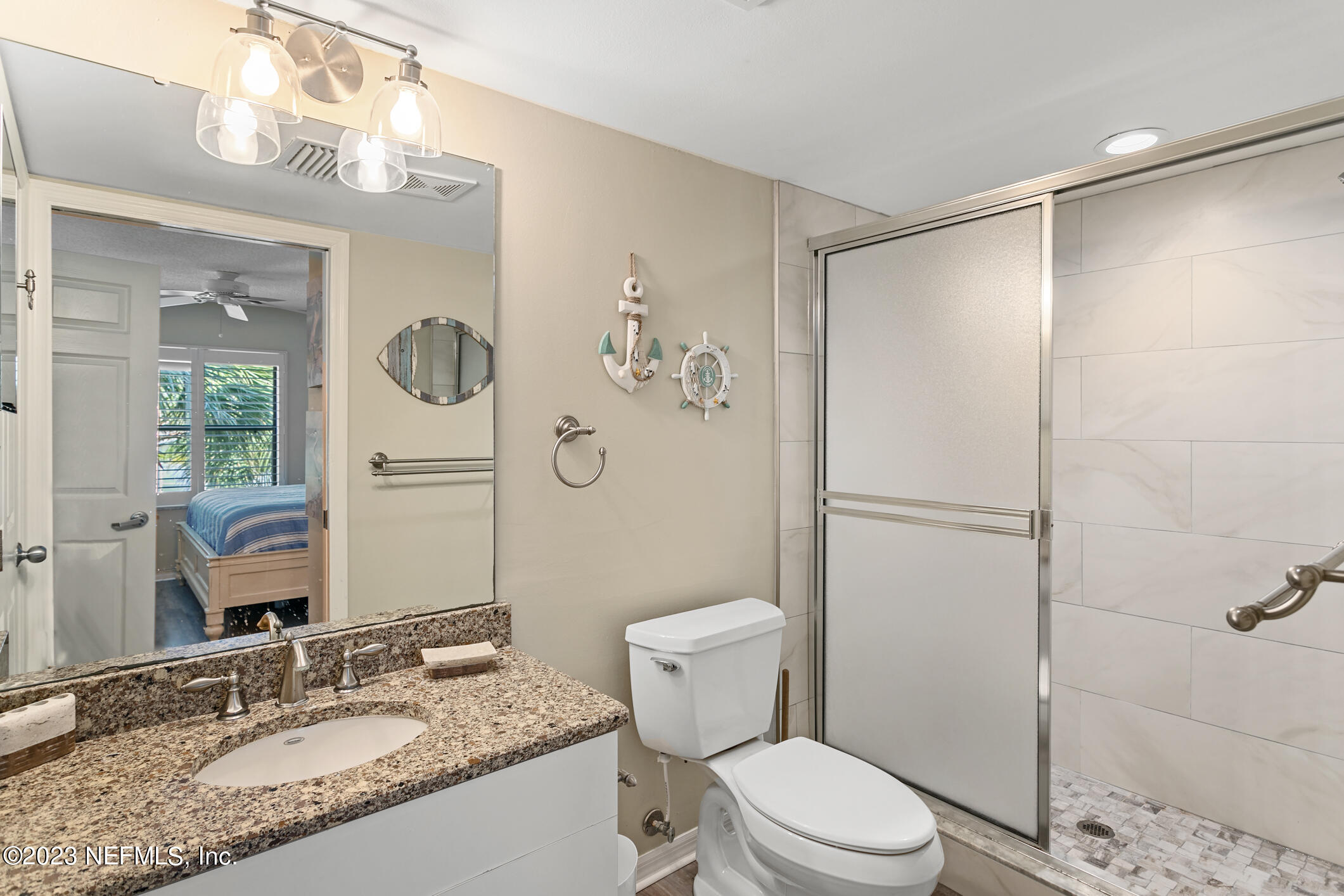 4250 Florida A1A, Unit I26 St. Augustine, FL 32080 - Photo 21 of 49 a bathroom with a granite countertop sink toilet and shower